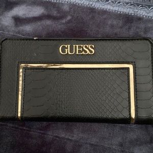 Used guess wallet with 7 card holders and cash slot.